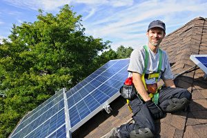 Man providing solar panel financing and installation service
